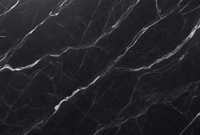 The primary subject of the image is a black marble countertop. The setting is a kitchen, with the countertop being the main focus of the scene. The visual style is a close-up of the marble countertop, showcasing its texture and pattern. The colors and mood of the image are predominantly dark, with the black marble countertop being the main source of contrast.