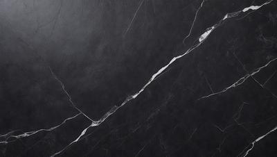 The primary subject of the image is a black marble countertop. The setting is a kitchen, with the countertop being the main focus of the scene. The visual style is a close-up of the marble countertop, showcasing its texture and details. The colors and mood of the image are predominantly dark, with the black marble countertop being the main source of contrast and visual interest.