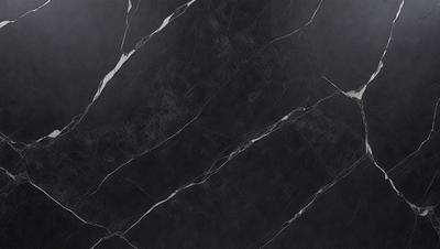 The primary subject of the image is a black marble countertop. The setting is a kitchen, with the countertop being the main focus of the scene. The visual style is a close-up of the marble countertop, showcasing its texture and pattern. The colors and mood of the image are predominantly dark, with the black marble countertop being the main source of contrast.