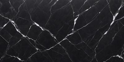The primary subject of the image is a black marble countertop. The setting is a kitchen, with the countertop being the main focus of the scene. The visual style is a close-up of the marble countertop, showcasing its texture and pattern. The colors and mood of the image are predominantly dark, with the black marble countertop being the main source of contrast.