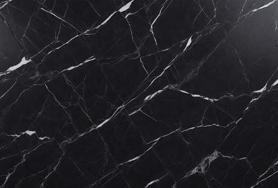 The primary subject of the image is a marble countertop with a black and white pattern. The setting is a kitchen, and the visual style is a close-up of the marble countertop. The colors and mood of the image are predominantly black and white, giving it a classic and elegant appearance.