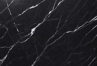 The primary subject of the image is a black marble countertop with white veins. The setting is a kitchen, and the visual style is a close-up of the marble countertop. The dominant colors are black and white, creating a sleek and elegant atmosphere.