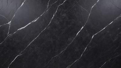 The primary subject of the image is a black marble countertop. The setting is a kitchen, with the countertop being the main focus of the scene. The visual style is a close-up of the marble countertop, showcasing its texture and details. The colors and mood of the image are dark and moody, with the black marble countertop being the dominant color.