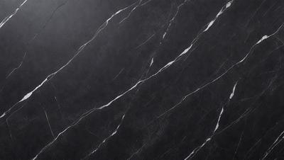 The primary subject of the image is a black marble countertop. The setting is a kitchen, with the countertop being the main focus of the scene. The visual style is a close-up of the marble countertop, showcasing its texture and pattern. The colors and mood of the image are dark and moody, with the black marble countertop being the dominant color.
