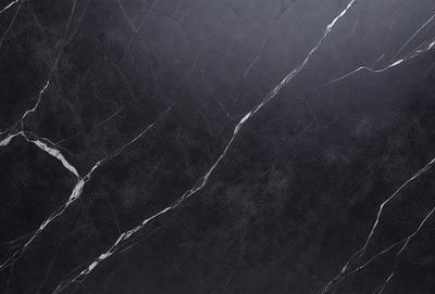 The primary subject of the image is a black marble countertop. The setting is a kitchen, with the countertop being the main focus of the scene. The visual style is a close-up of the marble countertop, showcasing its texture and details. The colors and mood of the image are predominantly dark, with the black marble countertop being the main source of contrast and visual interest.