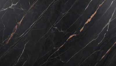 The primary subject of the image is a close-up of a black marble countertop. The setting is a kitchen, with the countertop being the main focus of the scene. The visual style is a photo, capturing the intricate details of the marble surface. The colors and mood of the image are predominantly dark, with the black marble providing a striking contrast against the surrounding environment.