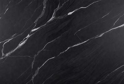 The primary subject of the image is a black marble tile with a pattern of white veins. The setting is a black background, which contrasts with the marble tile. The visual style is a close-up of the marble tile, showcasing its unique texture and pattern. The colors and mood of the image are predominantly dark, with the black marble tile and black background creating a dramatic and sophisticated atmosphere.