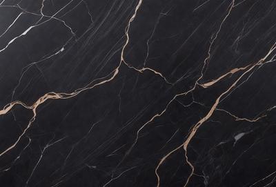 The primary subject of the image is a close-up of a marble countertop with a black and gold pattern. The setting is a kitchen, and the visual style is a photo. The dominant colors are black and gold, creating a luxurious and elegant atmosphere.