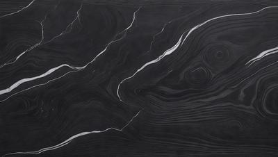 The primary subject of the image is a black marble countertop with a unique, swirling pattern. The setting is a kitchen or bathroom, as the countertop is a part of a counter. The visual style is a close-up of the marble countertop, showcasing its intricate design. The colors and mood of the image are dark and dramatic, with the black marble providing a striking contrast against the surrounding environment.