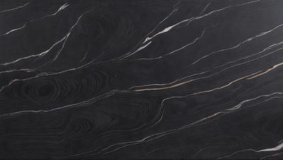 The primary subject of the image is a marble countertop with a black and gold pattern. The setting is a kitchen, and the visual style is a close-up of the marble countertop. The colors and mood of the image are predominantly black and gold, giving it a luxurious and elegant appearance.