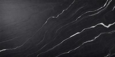 The primary subject of the image is a black marble countertop. The setting is a kitchen, with the countertop being the main focus of the scene. The visual style is a close-up of the marble countertop, showcasing its texture and details. The colors and mood of the image are dark and moody, with the black marble countertop being the dominant color.