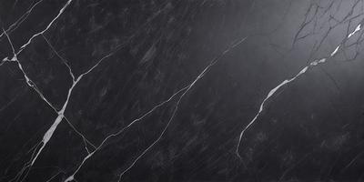 The primary subject of the image is a black marble countertop. The setting is a kitchen, with the countertop being the main focus of the scene. The visual style is a close-up of the marble countertop, showcasing its texture and details. The colors and mood of the image are predominantly dark, with the black marble countertop being the main source of contrast and visual interest.