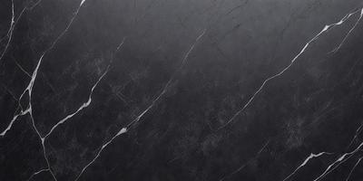 The primary subject of the image is a black marble countertop. The setting is a kitchen, with the countertop being the main focus of the scene. The visual style is a close-up of the marble countertop, showcasing its texture and details. The colors and mood of the image are predominantly dark, with the black marble countertop being the main source of contrast and visual interest.