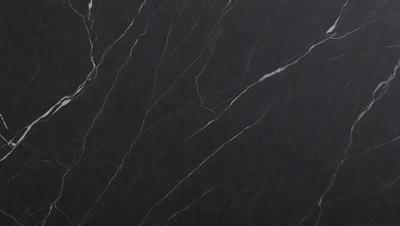 The primary subject of the image is a black marble countertop. The setting is a kitchen, with the countertop being the main focus of the scene. The visual style is a close-up of the marble countertop, showcasing its texture and details. The colors and mood of the image are predominantly dark, with the black marble countertop being the main source of contrast and visual interest.
