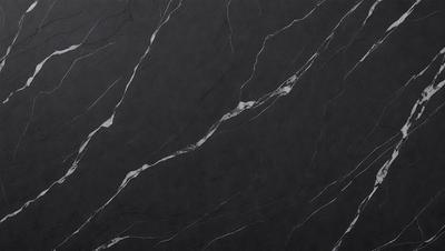 The primary subject of the image is a black marble countertop. The setting is a kitchen, with the countertop being the main focus of the scene. The visual style is a close-up of the marble countertop, showcasing its texture and pattern. The colors and mood of the image are dark and moody, with the black marble countertop being the dominant color.