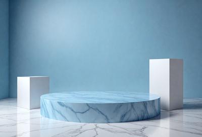 The primary subject of the image is a large, round, blue marble table. The table is placed on a white marble floor, which serves as the setting for the scene. The visual style of the image is a photo, capturing the details and colors of the marble table and floor. The dominant colors in the image are blue and white, creating a clean and elegant atmosphere.