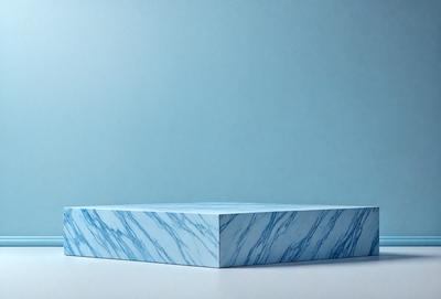 The primary subject of the image is a blue marble tabletop. The setting is a white background, which provides a clean and minimalist appearance. The visual style is a photo, capturing the natural beauty of the marble surface. The colors and mood of the image are predominantly blue, creating a calm and serene atmosphere.