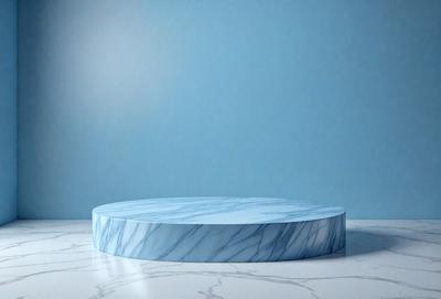 The primary subject of the image is a blue marble tabletop. The tabletop is placed on a white marble surface, which serves as the setting or background. The visual style of the image is a photo, capturing the details and colors of the marble tabletop and the white marble surface. The colors and mood of the image are predominantly blue and white, creating a clean and elegant atmosphere.