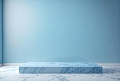 The primary subject of the image is a large, blue marble slab. The setting is a white background, which contrasts with the blue marble. The visual style is a photo, showcasing the marble's texture and color. The colors and mood of the image are predominantly blue, creating a calm and serene atmosphere.