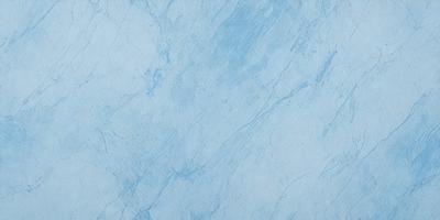 The primary subject of the image is a blue marble wall. The setting is a room with a blue marble wall, which serves as the background. The visual style is a photo, capturing the natural texture and color of the marble. The dominant colors are blue and white, creating a calm and serene atmosphere.