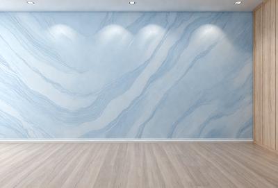 The primary subject of the image is a large, blue marble wall with a pattern of swirls. The setting is a room with a wooden floor, and the visual style appears to be a photo. The dominant colors are blue and white, creating a calm and serene atmosphere.