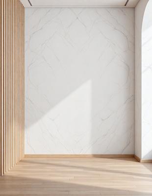 The primary subject of the image is a white marble wall. The setting is a room with a wooden floor, and the visual style is a photo. The dominant colors are white and gray, creating a clean and minimalist atmosphere.