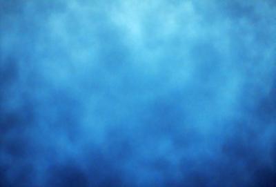The primary subject of the image is a blue sky with clouds. The setting is a vast, open space with no visible landmarks or objects. The visual style is a natural, outdoor scene. The dominant colors are blue and white, creating a calm and serene atmosphere.