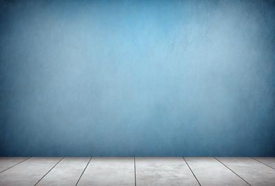 The primary subject of the image is a blue wall with a white wooden floor. The setting is a room with a blue wall and a wooden floor. The visual style is a photo, and the colors and mood are predominantly blue and calm.