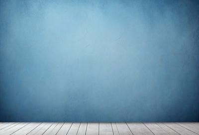 The primary subject of the image is a blue wall with a wooden floor. The setting is a room with a blue wall and a wooden floor. The visual style is a photo of a blue wall with a wooden floor. The dominant colors are blue and brown, creating a calm and serene atmosphere.