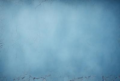 The primary subject of the image is a blue sky with a few clouds. The setting is a clear blue sky, and the visual style is a photo. The colors and mood of the image are predominantly blue, creating a calm and serene atmosphere.
