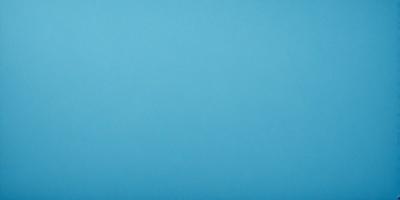 The primary subject of the image is a large, open, and empty blue sky. The setting is a vast, cloudless expanse, with no visible landmarks or objects. The visual style is a natural, untouched landscape, with no indication of digital manipulation or artistic elements. The colors and mood are predominantly blue, creating a serene and tranquil atmosphere.
