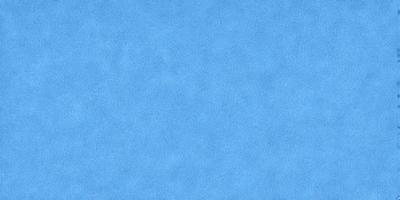 The primary subject of the image is a large, blue, textured surface. The setting is a clear, blue sky, which serves as the backdrop for the textured surface. The visual style of the image is a photo, capturing the vibrant blue hue and the intricate texture of the surface. The colors and mood of the image are predominantly blue, creating a serene and calming atmosphere.