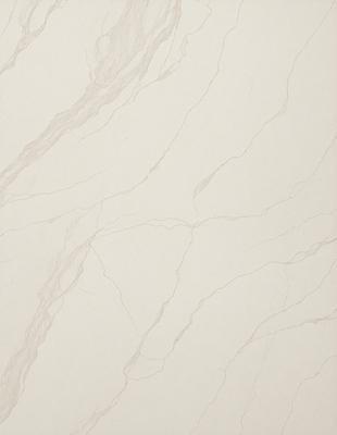 The primary subject of the image is a white marble wall with a pattern of swirls and lines. The setting is a room with a white marble floor, which complements the wall. The visual style is a close-up of the marble wall, showcasing its intricate design. The colors and mood of the image are predominantly white, giving it a clean and elegant appearance.