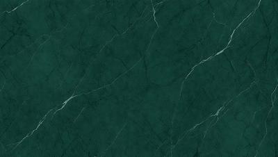 The primary subject of the image is a close-up of a green marble wall. The setting is a room with a green marble wall, which serves as the background. The visual style is a photo, capturing the intricate details of the marble surface. The colors and mood of the image are predominantly green, giving it a natural and serene atmosphere.
