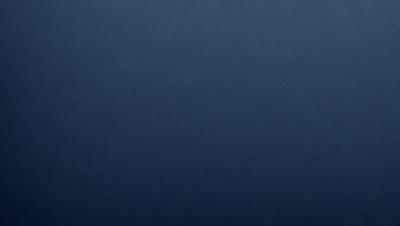 The primary subject of the image is a dark blue sky. The setting is a vast, open space with no visible landmarks or objects. The visual style is a simple, monochromatic image with no additional elements or textures. The colors and mood convey a sense of calmness and tranquility.