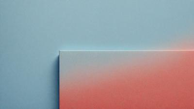 The primary subject of the image is a piece of artwork, possibly a painting or a drawing, featuring a pink and blue color scheme. The artwork is displayed on a blue surface, which serves as the setting or background. The visual style of the image is a close-up, focusing on the artwork and its colors. The dominant colors in the image are pink and blue, creating a warm and inviting atmosphere.