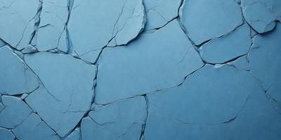 The primary subject of the image is a blue wall with a cracked and chipped appearance. The setting is a room with a blue background. The visual style is a photo, and the dominant colors are blue and white. The overall atmosphere is somewhat distressed and aged, possibly suggesting a vintage or aged aesthetic.