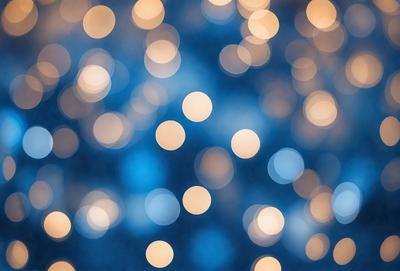 The primary subject of the image is a blue background with a pattern of bright, white, and yellow lights. The lights are scattered throughout the background, creating a visually appealing and dynamic scene. The setting appears to be a nighttime sky, with the lights creating a sense of depth and movement. The visual style of the image is a combination of digital art and illustration, as the lights are carefully placed and the overall composition is well-executed. The colors and mood of the image are predominantly blue, white, and