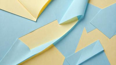 The primary subject of the image is a collection of yellow and blue paper, which are arranged in a visually appealing manner. The setting is a blue and yellow background, creating a vibrant and lively atmosphere. The visual style is a combination of digital art and illustration, as the paper is carefully crafted and arranged to create a cohesive and eye-catching design. The colors and mood of the image are predominantly blue and yellow, evoking a sense of warmth and energy.