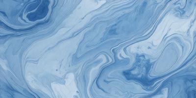 The primary subject of the image is a blue and white ocean wave. The setting is the ocean, with the wave crashing against the surface. The visual style is a photo of the ocean, capturing the beauty and power of the wave. The dominant colors are blue and white, creating a serene and calming atmosphere.