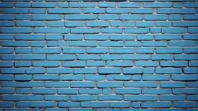The primary subject of the image is a blue brick wall. The setting is a brick wall with a blue color, and the visual style is a photo. The dominant colors are blue and white, creating a calm and serene atmosphere.