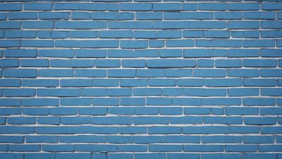 The primary subject of the image is a blue brick wall. The setting is a brick wall, and the visual style is a photo. The dominant colors are blue and white, creating a calm and serene atmosphere.