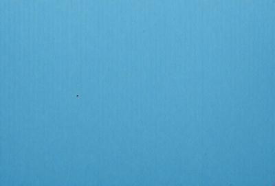 The primary subject of the image is a blue background with a single red dot. The setting is a blue surface, and the visual style appears to be a simple, minimalist design. The colors and mood of the image are predominantly blue and calm, with the red dot adding a touch of contrast and interest.