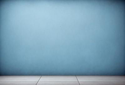 The primary subject of the image is a blue wall with a white tile floor. The setting is a room with a blue wall and a white tile floor. The visual style is a photo, and the colors and mood are predominantly blue and calm.
