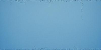 The primary subject of the image is a blue background with a white border. The setting is a blue wall, and the visual style is a digital art or illustration. The dominant colors are blue and white, creating a calm and serene atmosphere.