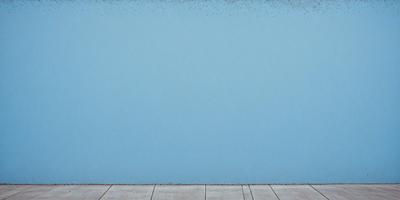 The primary subject of the image is a blue wall with a white border. The setting is a room with a blue wall, and the visual style is a painting. The dominant colors are blue and white, creating a calm and serene atmosphere.