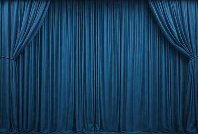 The primary subject of the image is a blue curtain, which is the main object, scene, or focus of the image. The setting is a stage or theater, with the curtains hanging down. The visual style is a photo, and the dominant colors are blue and purple, creating a calm and serene atmosphere.