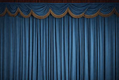 The primary subject of the image is a blue curtain, which is the main object, scene, or focus of the image. The setting is a stage or theater, with the curtain hanging down in front of a blue background. The visual style is a photo, and the dominant colors are blue and black, creating a dramatic and moody atmosphere.