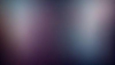 The primary subject of the image is a purple wall. The setting is a room with a purple wall, and the visual style is a photo. The dominant colors in the image are purple and blue, creating a calm and serene atmosphere.