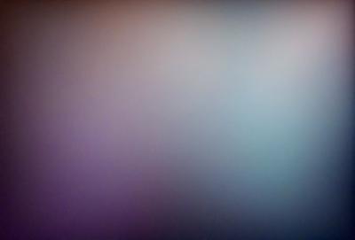 The primary subject of the image is a purple wall. The setting is a room with a purple wall, and the visual style is a photo. The dominant colors in the image are purple and blue, creating a calm and serene atmosphere.